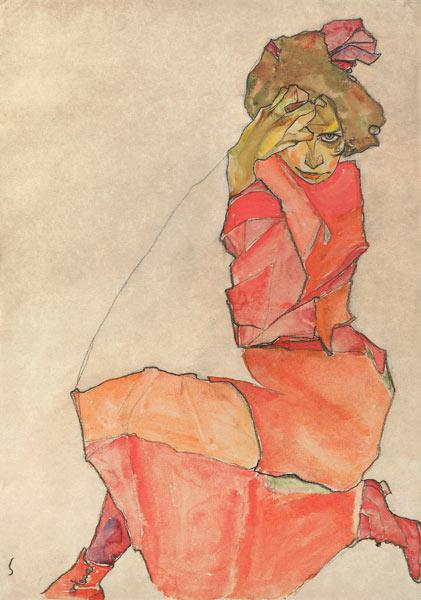 Kniendes Mädchen in orange-rotem Kleid 1910