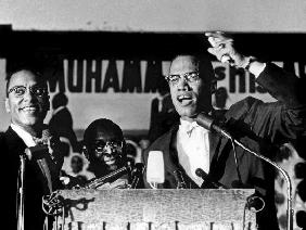 Malcolm X during a speech during a rally of Nation of Islam at Uline Arena, Washington, photo by Ric August 196